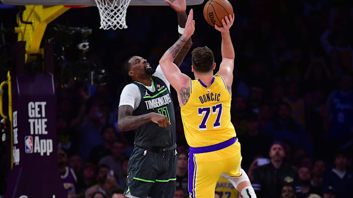Apr 30, 2025; Los Angeles, California, USA; Los Angeles Lakers guard Luka Doncic (77) shoots against Minnesota Timberwolves center Naz Reid (11) during the second half in game five of first round for the 2025 NBA Playoffs at Crypto.com Arena. Mandatory Credit: Gary A. Vasquez-Imagn Images Apr 30, 2025; Los Angeles, California, USA; Los Angeles Lakers guard Luka Doncic (77) shoots against Minnesota Timberwolves center Naz Reid (11) during the second half in game five of first round for the 2025 NBA Playoffs at Crypto.com Arena. Mandatory Credit: Gary A. Vasquez-Imagn Images