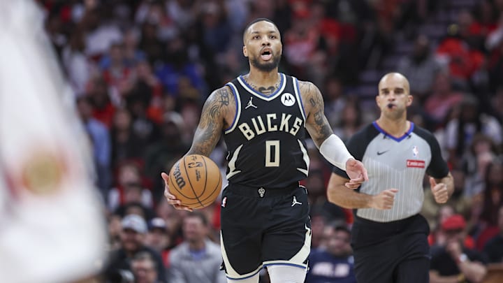 Feb 25, 2025; Houston, Texas, USA; Milwaukee Bucks guard Damian Lillard (0) brings the ball up the court during the fourth quarter against the Houston Rockets at Toyota Center. Mandatory Credit: Troy Taormina-Imagn Images