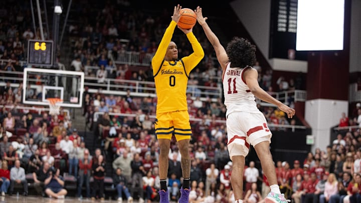 Feb 22, 2025; Stanford, California, USA; California Golden Bears guard Jeremiah Wilkinson (0) attempts a three-point basket over Stanford Cardinal guard Ryan Agarwal (11) in the closing seconds of the second half at Maples Pavilion. Mandatory Credit: D. Ross Cameron-Imagn Images Feb 22, 2025; Stanford, California, USA; California Golden Bears guard Jeremiah Wilkinson (0) attempts a three-point basket over Stanford Cardinal guard Ryan Agarwal (11) in the closing seconds of the second half at Maples Pavilion. Mandatory Credit: D. Ross Cameron-Imagn Images