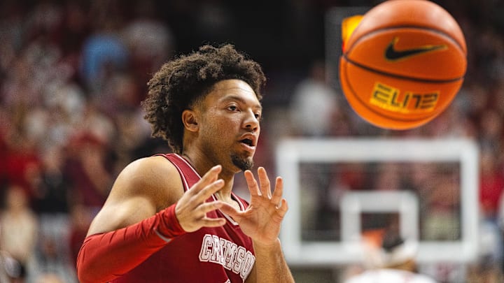 Feb 15, 2025; Tuscaloosa, Alabama, USA; Alabama Crimson Tide guard Mark Sears (1) receives the ball against the Auburn Tigers during the first half at Coleman Coliseum. Mandatory Credit: Will McLelland-Imagn Images