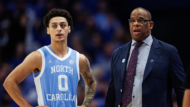 Dec 2, 2025; Lexington, Kentucky, USA; North Carolina Tar Heels head coach Hubert Davis talks with guard Kyan Evans (0) during the second half against the Kentucky Wildcats at Rupp Arena at Central Bank Center. Mandatory Credit: Jordan Prather-Imagn Images Dec 2, 2025; Lexington, Kentucky, USA; North Carolina Tar Heels head coach Hubert Davis talks with guard Kyan Evans (0) during the second half against the Kentucky Wildcats at Rupp Arena at Central Bank Center. Mandatory Credit: Jordan Prather-Imagn Images