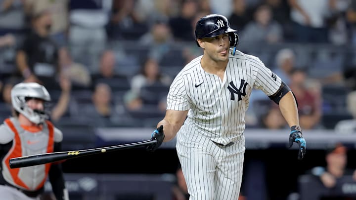 Sep 26, 2025; Bronx, New York, USA; New York Yankees designated hitter Giancarlo Stanton (27) watches his two run home run against the Baltimore Orioles during the first inning at Yankee Stadium. Mandatory Credit: Brad Penner-Imagn Images
