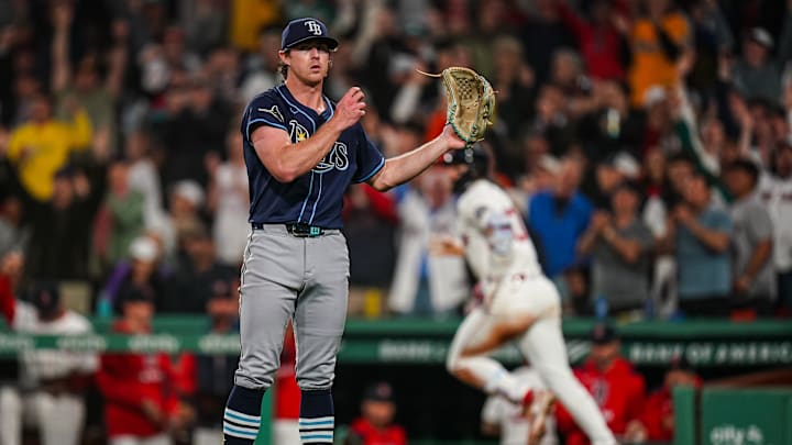 Boston, Massachusetts, USA; Tampa Bay Rays pitcher Ryan Pepiot (44) looks on as Boston Red Sox shortstop Trevor Story (10) hits a home run in the sixth inning at Fenway Park. Boston, Massachusetts, USA; Tampa Bay Rays pitcher Ryan Pepiot (44) looks on as Boston Red Sox shortstop Trevor Story (10) hits a home run in the sixth inning at Fenway Park.