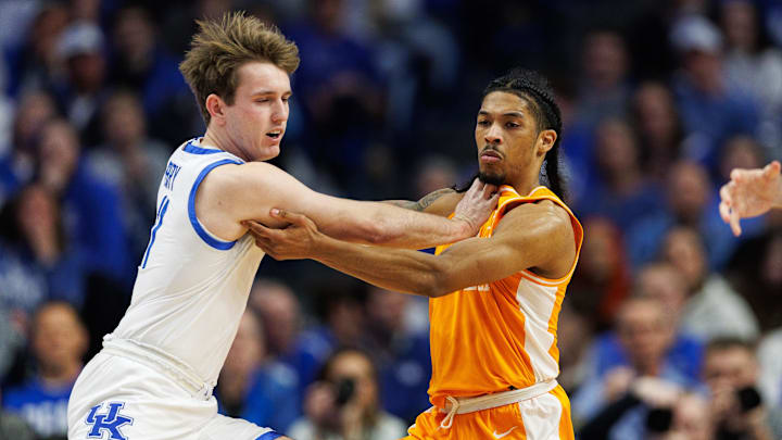 Feb 11, 2025; Lexington, Kentucky, USA; Kentucky Wildcats guard Travis Perry (11) and Tennessee Volunteers guard Zakai Zeigler (5) jostle for position during the first half at Rupp Arena at Central Bank Center. Mandatory Credit: Jordan Prather-Imagn Images
