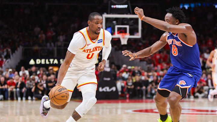 Apr 23, 2026; Atlanta, Georgia, USA; Atlanta Hawks forward Jonathan Kuminga (0) drives on New York Knicks forward Og Anunoby (8) in the third quarter during game three of the first round of the 2026 NBA Playoffs at State Farm Arena. Mandatory Credit: Brett Davis-Imagn Images