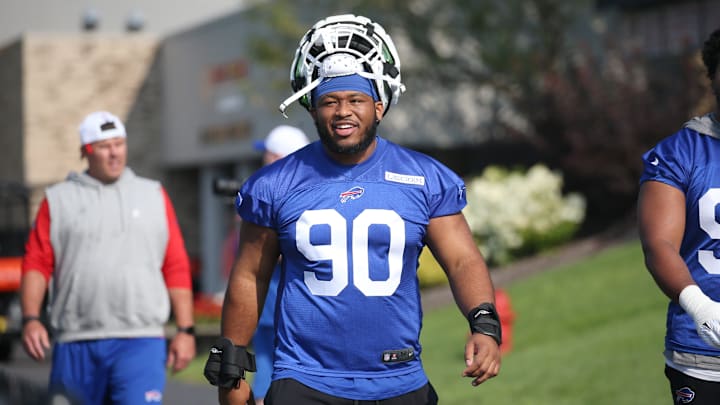 Bills defensive tackle DeWayne Carter heads to the field on the opening day of Buffalo Bills training camp at St. John Fisher University.