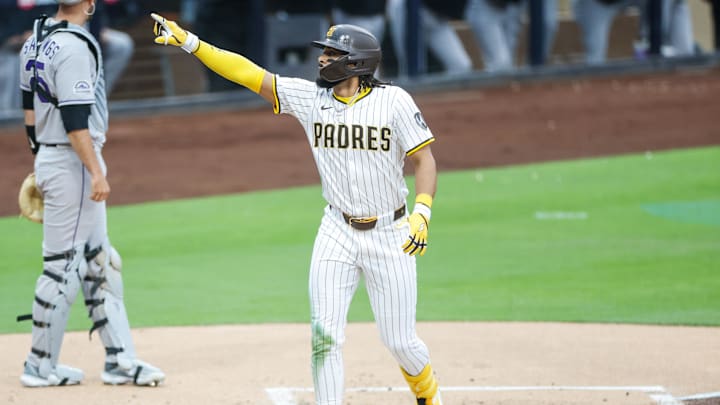 San Diego, California, USA; San Diego Padres right fielder Fernando Tatis Jr. (23) celebrates with the fans after hitting a one-run home run during the first inning against the Colorado Rockies at Petco Park.