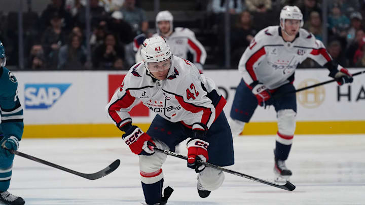 Mar 15, 2025; San Jose, California, USA;  Washington Capitals defenseman Martin Fehervary (42) advances the puck in the first period against the San Jose Sharks at SAP Center at San Jose. Mandatory Credit: David Gonzales-Imagn Images