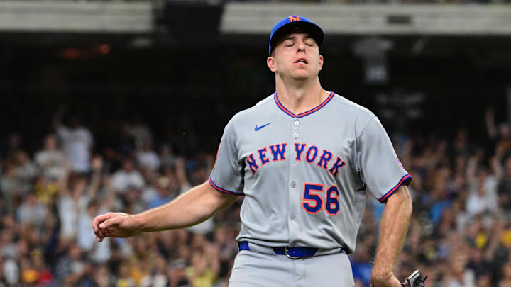 Aug 10, 2025; Milwaukee, Wisconsin, USA; New York Mets pitcher Ryan Helsley (56) reacts after giving up the tying run in the eighth inning against the Milwaukee Brewers at American Family Field. Mandatory Credit: Benny Sieu-Imagn Images