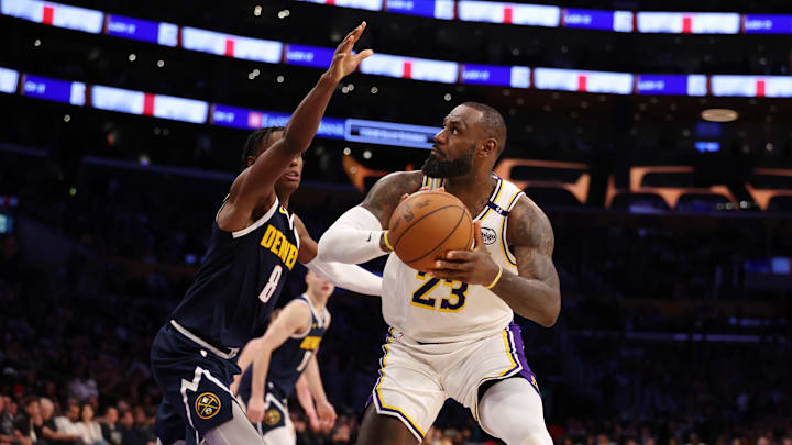 Nov 23, 2024; Los Angeles, California, USA; Los Angeles Lakers forward LeBron James (23) looks to shoot against Denver Nuggets forward Peyton Watson (8) during the fourth quarter at Crypto.com Arena. Mandatory Credit: Kiyoshi Mio-Imagn Images Nov 23, 2024; Los Angeles, California, USA; Los Angeles Lakers forward LeBron James (23) looks to shoot against Denver Nuggets forward Peyton Watson (8) during the fourth quarter at Crypto.com Arena. Mandatory Credit: Kiyoshi Mio-Imagn Images