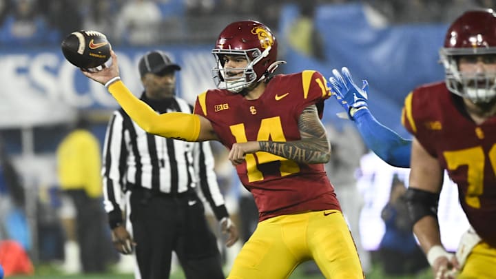 Nov 23, 2024; Pasadena, California, USA; USC Trojans quarterback Jayden Maiava (14) throws a pass during the fourth quarter against the UCLA Bruins at Rose Bowl. Mandatory Credit: Robert Hanashiro-Imagn Images
