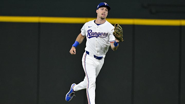 May 2, 2024; Arlington, Texas, USA; Texas Rangers center fielder Evan Carter (32) catches a fly ball against the Washington Nationals during the seventh inning at Globe Life Field. 