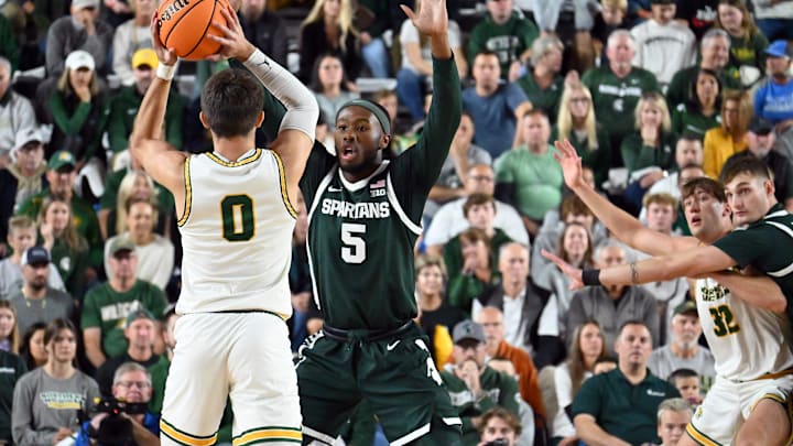 Michigan State men's basketball coach Tom Izzo returned to the Upper Peninsula and Northern Michigan University for the Spartans' exhibition 2024-25 season opener against NMU. Izzo, a 1977 NMU graduate, was also honored with his jersey No. 10 retired during the game.