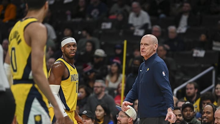 Dec 15, 2023; Washington, District of Columbia, USA;  Indiana Pacers head coach Rick Carlisle  speaks with guard Tyrese Haliburton (0) and  guard Buddy Hield (7) during the game against the Washington Wizards at Capital One Arena. Washington Wizards defeated Indiana Pacers 137-123. Mandatory Credit: Tommy Gilligan-USA TODAY Sports