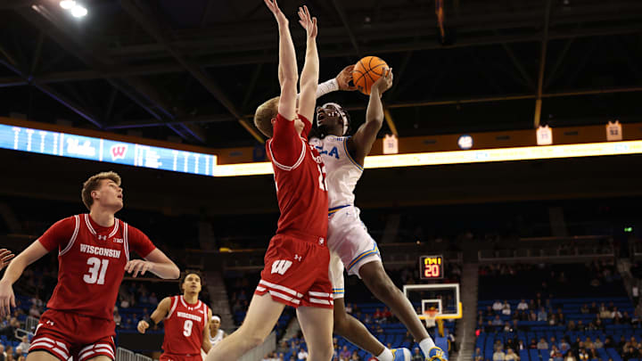 Jan 21, 2025; Los Angeles, California, USA; UCLA Bruins guard Eric Dailey Jr. (3) shoots against Wisconsin Badgers forward Steven Crowl (22) during the first half at Pauley Pavilion presented by Wescom. Mandatory Credit: Kiyoshi Mio-Imagn Images Jan 21, 2025; Los Angeles, California, USA; UCLA Bruins guard Eric Dailey Jr. (3) shoots against Wisconsin Badgers forward Steven Crowl (22) during the first half at Pauley Pavilion presented by Wescom. Mandatory Credit: Kiyoshi Mio-Imagn Images