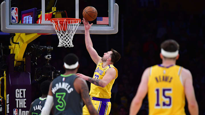 Apr 30, 2025; Los Angeles, California, USA; Los Angeles Lakers guard Luka Doncic (77) shoots against the Minnesota Timberwolves during the second half in game five of first round for the 2025 NBA Playoffs at Crypto.com Arena. Mandatory Credit: Gary A. Vasquez-Imagn Images