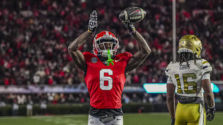 Nov 29, 2024; Athens, Georgia, USA; Georgia Bulldogs wide receiver Dominic Lovett (6) reacts after catching a touchdown pass against the Georgia Tech Yellow Jackets during the second half at Sanford Stadium. Mandatory Credit: Dale Zanine-Imagn Images