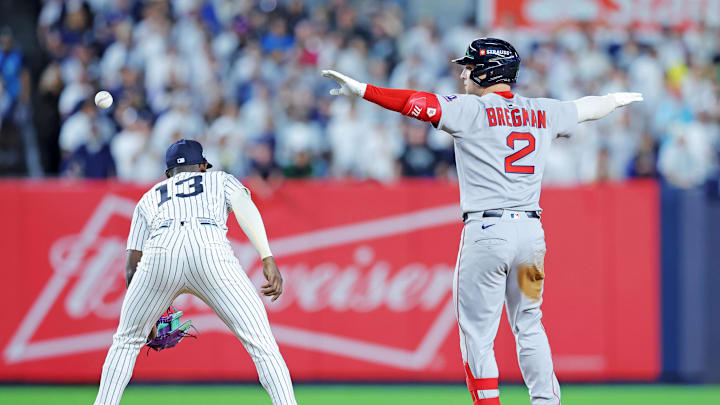 Sep 30, 2025; Bronx, New York, USA; Boston Red Sox third base Alex Bregman (2) reacts after hitting an RBI double during the ninth inning against the New York Yankees during game one of the Wildcard round for the 2025 MLB playoffs at Yankee Stadium. Mandatory Credit: Brad Penner-Imagn Images