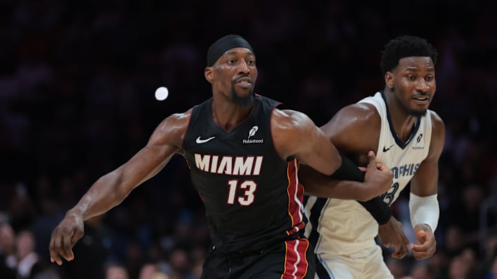 Apr 3, 2025; Miami, Florida, USA; Miami Heat center Bam Adebayo (13) is guarded by Memphis Grizzlies forward Jaren Jackson Jr. (13) during the fourth quarter at Kaseya Center. Mandatory Credit: Sam Navarro-Imagn Images
