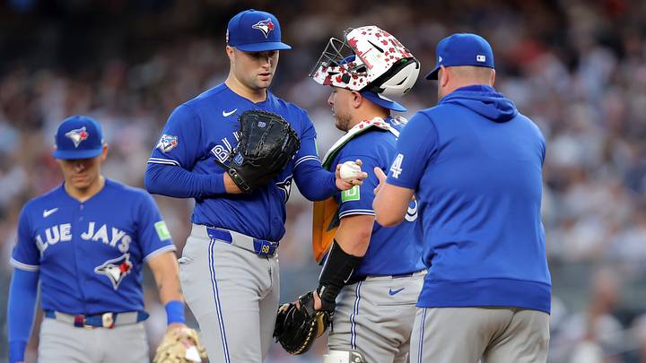 Toronto Blue Jays starting pitcher Mason Fluharty hands the ball to Toronto Blue Jays manager John Schneider. Credit: Brad Penner-Imagn Images Toronto Blue Jays starting pitcher Mason Fluharty hands the ball to Toronto Blue Jays manager John Schneider. Credit: Brad Penner-Imagn Images