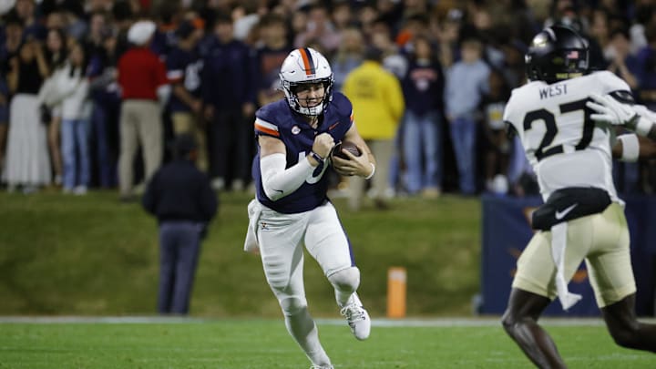 Nov 8, 2025; Charlottesville, Virginia, USA; Virginia Cavaliers quarterback Daniel Kaelin (10) runs with the ball against the Wake Forest Demon Deacons during the first half at Scott Stadium. Mandatory Credit: Amber Searls-Imagn Images