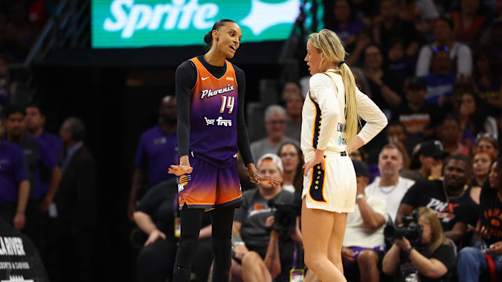 Aug 7, 2025; Phoenix, Arizona, USA; Indiana Fever guard Sophie Cunningham (8) reacts alongside Phoenix Mercury forward DeWanna Bonner (14) in the first half of a WNBA game at PHX Arena. Mandatory Credit: Mark J. Rebilas-Imagn Images
