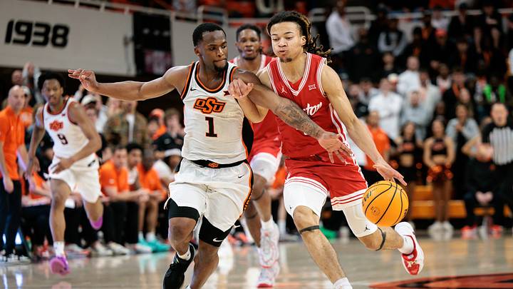 Mar 7, 2026; Stillwater, Oklahoma, USA; Houston Cougars guard Kingston Flemings (4) drives to the basket around Oklahoma State Cowboys guard Kanye Clary (1) during the second half at Gallagher-Iba Arena. Mandatory Credit: William Purnell-Imagn Images