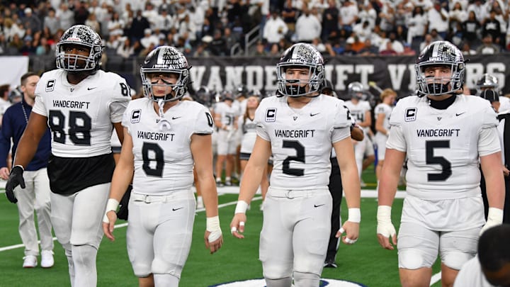 Austin Vandegrift's captains walk to midfield during the 6A DII UIL Texas State Football Championship game against Southlake Carroll on Saturday, December 21, 2024 at AT&T Stadium in Arlington.