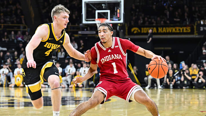 Indiana guard Myles Rice (1) controls the ball against Iowa guard Josh Dix (4) during the Hoosiers' 85-60 loss Saturday night.