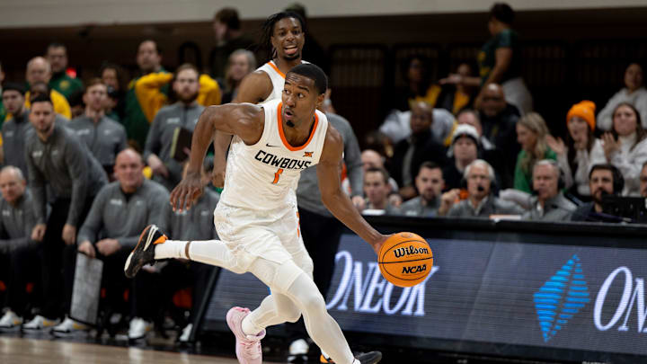 Jan 6, 2024; Stillwater, Okla, USA; Oklahoma State Cowboys guard Bryce Thompson (1) brings the ball