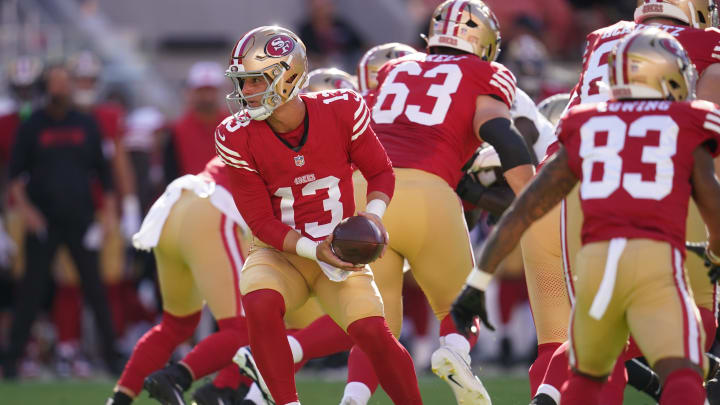Aug 18, 2024; Santa Clara, California, USA; San Francisco 49ers quarterback Brock Purdy (13) holds onto the ball after taking a snap against the New Orleans Saints in the first quarter at Levi's Stadium. Mandatory Credit: Cary Edmondson-USA TODAY Sports Aug 18, 2024; Santa Clara, California, USA; San Francisco 49ers quarterback Brock Purdy (13) holds onto the ball after taking a snap against the New Orleans Saints in the first quarter at Levi's Stadium. Mandatory Credit: Cary Edmondson-USA TODAY Sports