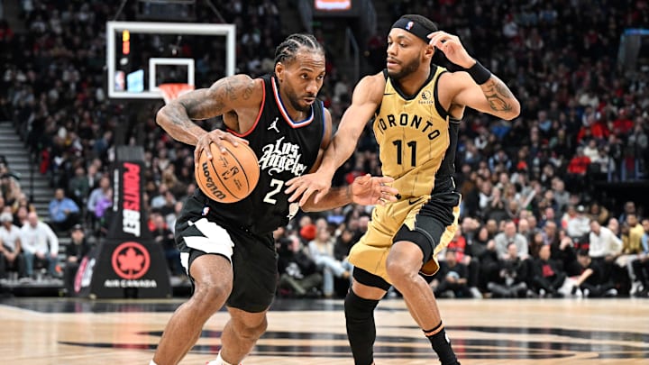 Los Angeles Clippers forward Kawhi Leonard (2) dribble the ball past Toronto Raptors guard Bruce Brown (11) in the second half at Scotiabank Arena. Mandatory Credit: Dan Hamilton-Imagn Images