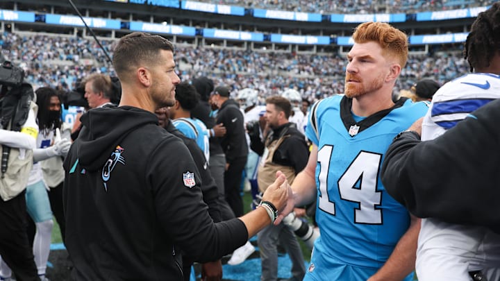Oct 12, 2025; Charlotte, North Carolina, USA; Carolina Panthers head coach Dave Canales shakes hands with Carolina Panthers quarterback Andy Dalton (14) after the game against the Dallas Cowboys at Bank of America Stadium. Mandatory Credit: Cory Knowlton-Imagn Images