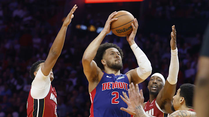 Mar 8, 2026; Miami, Florida, USA;  Miami Heat guard Dru Smith (12), center Bam Adebayo (13) and center Kel'el Ware (7) defend Detroit Pistons guard Cade Cunningham (2) during the second half at Kasey Center. Mandatory Credit: Rhona Wise-Imagn Images