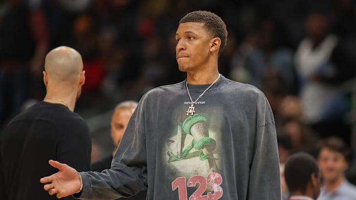 Jan 28, 2025; Atlanta, Georgia, USA; Houston Rockets forward Jabari Smith Jr. (10) during a timeout against the Atlanta Hawks in the fourth quarter at State Farm Arena. Mandatory Credit: Brett Davis-Imagn Images