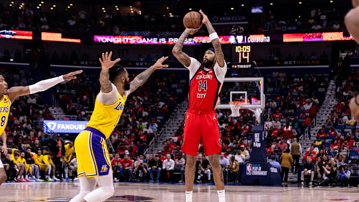 Apr 16, 2024; New Orleans, Louisiana, USA; New Orleans Pelicans forward Brandon Ingram (14) shoots a jump shot against the Los Angeles Lakers during the first half of a play-in game of the 2024 NBA playoffs at Smoothie King Center. 