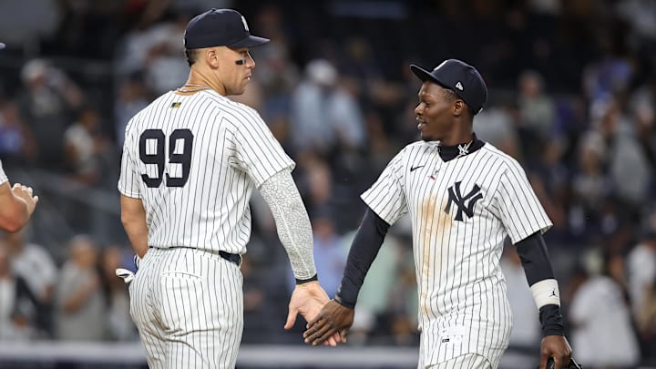 Aug 26, 2025; Bronx, New York, USA; New York Yankees designated hitter Aaron Judge (99) and second baseman Jazz Chisholm Jr. (13) celebrate after defeating the Washington Nationals 5-1 at Yankee Stadium. Mandatory Credit: Wendell Cruz-Imagn Images