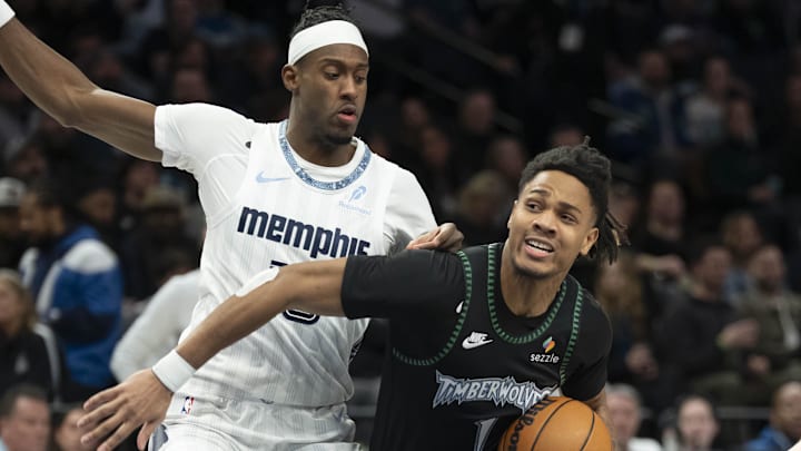 Dec 17, 2025; Minneapolis, Minnesota, USA; Minnesota Timberwolves guard Terrence Shannon Jr. (1) drives to the basket past Memphis Grizzlies forward Olivier-Maxence Prosper (18) in the second half at Target Center. Mandatory Credit: Jesse Johnson-Imagn Images