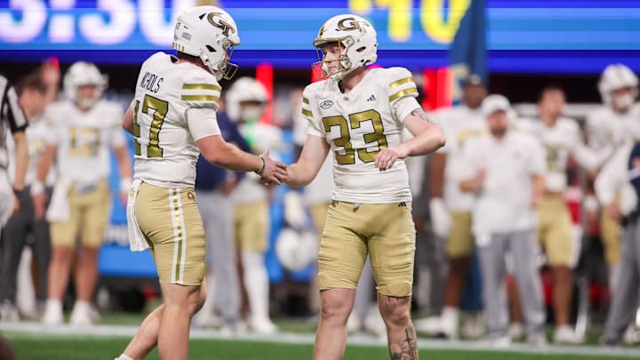 Nov 28, 2025; Atlanta, Georgia, USA; Georgia Tech Yellow Jackets kicker Aidan Birr (33) celebrates after a field goal with punter Marshall Nichols (47) against the Georgia Bulldogs in the fourth quarter at Mercedes-Benz Stadium. Mandatory Credit: Brett Davis-Imagn Images