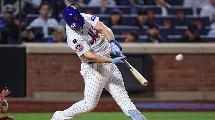 Apr 29, 2025; New York City, New York, USA; New York Mets first baseman Pete Alonso (20) hits a solo home run during the fourth inning against the Arizona Diamondbacks at Citi Field. Mandatory Credit: Vincent Carchietta-Imagn Images
