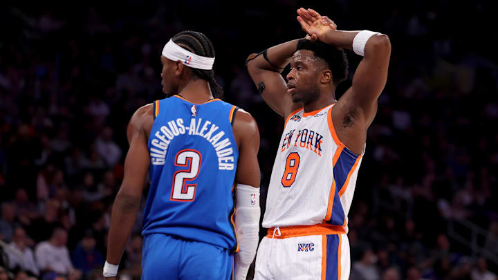 Jan 10, 2025; New York, New York, USA; New York Knicks forward OG Anunoby (8) reacts during the third quarter against Oklahoma City Thunder guard Shai Gilgeous-Alexander (2) at Madison Square Garden. Mandatory Credit: Brad Penner-Imagn Images