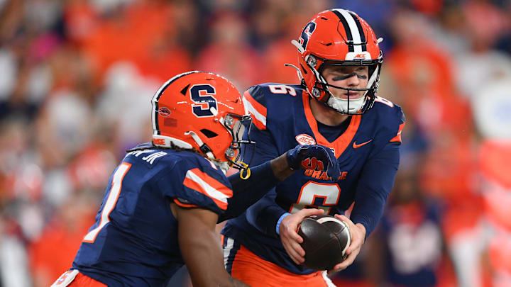 Sep 20, 2024; Syracuse, New York, USA; Syracuse Orange quarterback Kyle McCord (6) hands off to running back LeQuint Allen (1) against the Stanford Cardinal during the first half at the JMA Wireless Dome. Mandatory Credit: Rich Barnes-Imagn Images