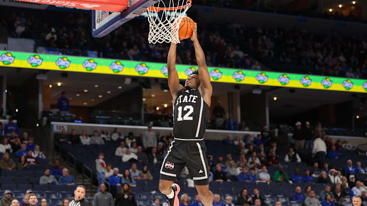 Dec 21, 2024; Memphis, Tennessee, USA; Mississippi State Bulldogs guard Josh Hubbard (12) dunks the ball against the Memphis Tigers during the second half at FedExForum. Mandatory Credit: Wesley Hale-Imagn Images