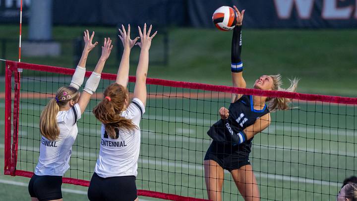 Piper Ladwig of Waukee Northwest spikes the ball as during a match with Ankeny Centennial to open the volleyball season under the lights at Valley Stadium in West Des Moines, Thursday, August 27, 2026. Piper Ladwig of Waukee Northwest spikes the ball as during a match with Ankeny Centennial to open the volleyball season under the lights at Valley Stadium in West Des Moines, Thursday, August 27, 2026.