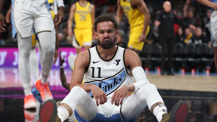 Mar 8, 2025; Atlanta, Georgia, USA; Atlanta Hawks guard Trae Young (11) sits on the court after being fouled by Indiana Pacers forward Pascal Siakam (43) during the first quarter at State Farm Arena. Mandatory Credit: Mady Mertens-Imagn Images