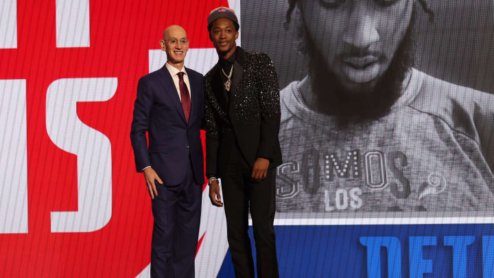 Jun 26, 2024; Brooklyn, NY, USA; Ron Holland II poses for photos with NBA commissioner Adam Silver after being selected in the first round by the Detroit Pistons in the 2024 NBA Draft at Barclays Center. Mandatory Credit: Brad Penner-USA TODAY Sports Jun 26, 2024; Brooklyn, NY, USA; Ron Holland II poses for photos with NBA commissioner Adam Silver after being selected in the first round by the Detroit Pistons in the 2024 NBA Draft at Barclays Center. Mandatory Credit: Brad Penner-USA TODAY Sports