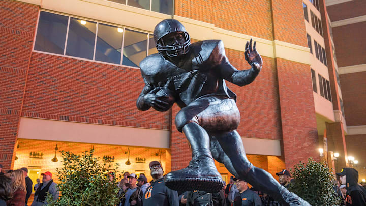 Nov 13, 2021; Stillwater, Oklahoma, USA; A statue in honor of Barry Sanders is unveiled during a ceremony at Boone Pickens Stadium before the game between Texas Christian and Oklahoma State. Mandatory Credit: Brett Rojo-Imagn Images Nov 13, 2021; Stillwater, Oklahoma, USA; A statue in honor of Barry Sanders is unveiled during a ceremony at Boone Pickens Stadium before the game between Texas Christian and Oklahoma State. Mandatory Credit: Brett Rojo-Imagn Images