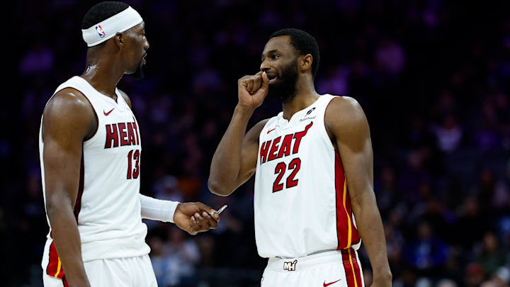 Jan 20, 2026; Sacramento, California, USA; Miami Heat center Bam Adebayo (13) and forward Andrew Wiggins (22) talk a timeout during the second quarter against the Sacramento Kings at Golden 1 Center. Mandatory Credit: Sergio Estrada-Imagn Images