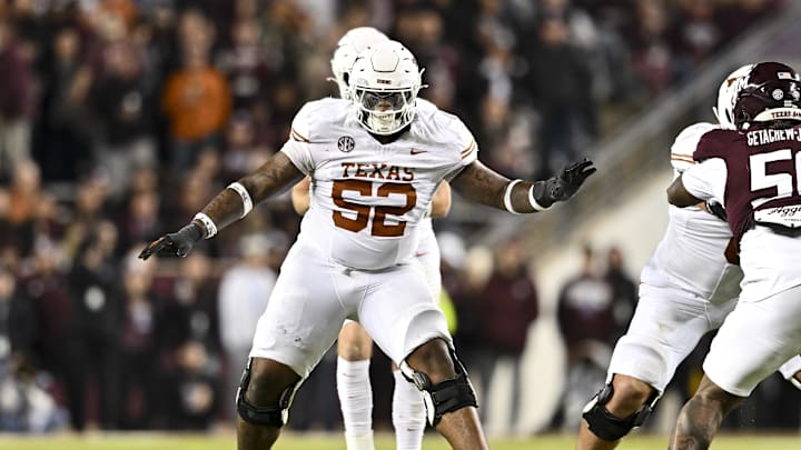 Nov 30, 2024; College Station, Texas, USA; Texas Longhorns offensive lineman DJ Campbell (52) blocks during the second half against the Texas A&M Aggies. The Longhorns defeated the Aggies 17-7 at Kyle Field. Mandatory Credit: Maria Lysaker-Imagn Images  