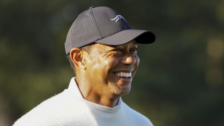 Apr 8, 2024; Augusta, Georgia, USA; Tiger Woods smiles as he walks on the practice green during a practice round for the Masters Tournament golf tournament at Augusta National Golf Club. Mandatory Credit: Kyle Terada-USA TODAY Network
